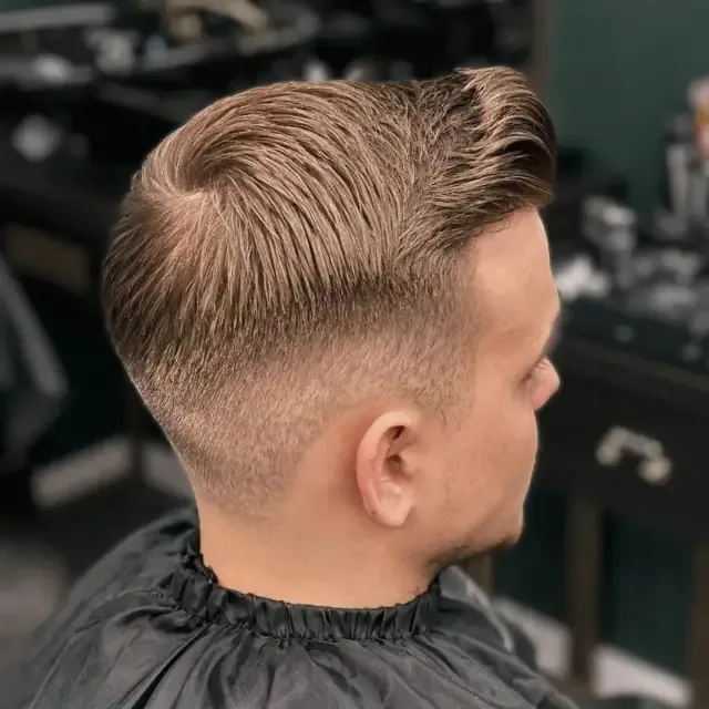Blond fade back view at Gentlemen Barber Shop Krakow in Kazimierz