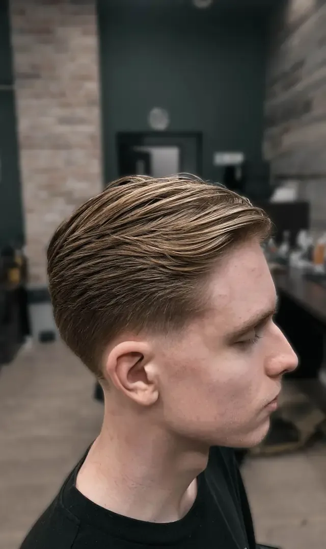 Longer side part at Gentlemen Barber Shop Krakow in Kazimierz
