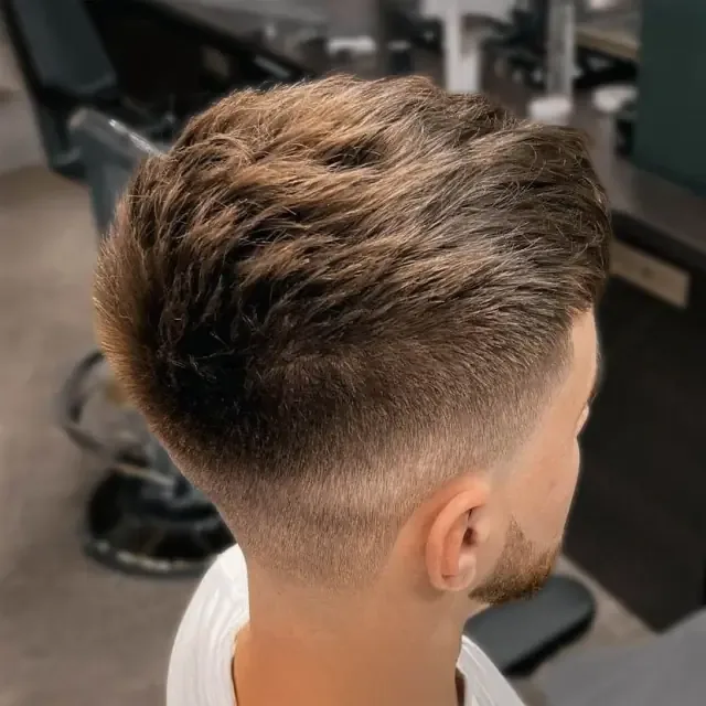 Blond fade back view at Gentlemen Barber Shop Krakow in Kazimierz