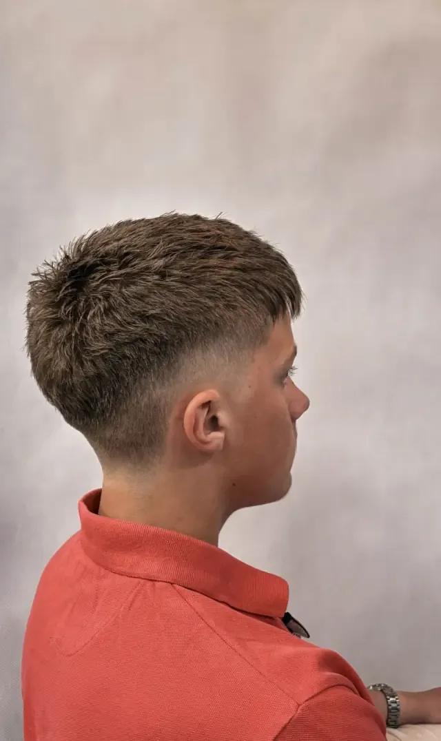 Fade in red T-shirt at Gentlemen Barber Shop Krakow in Kazimierz